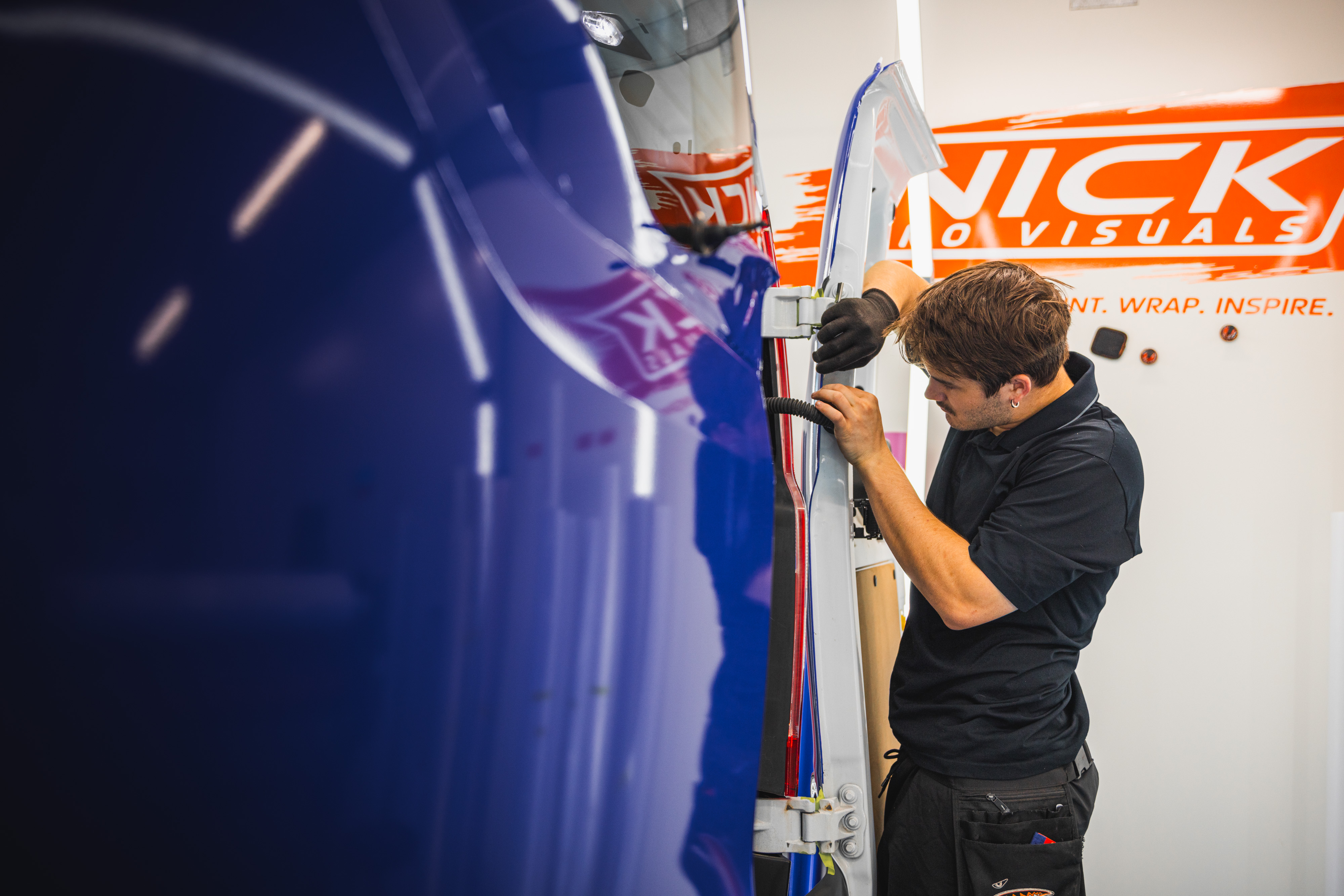 Nick Pro Visuals workshop - professional vehicle wrap installation in Logan, QLD